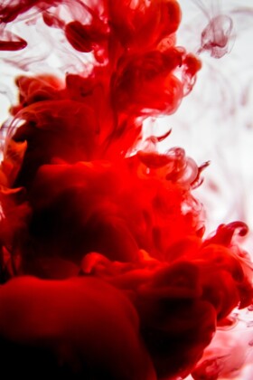 red ink isolated in water