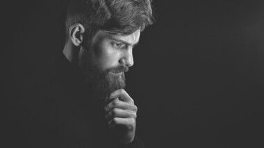 man with full beard in side profile black white